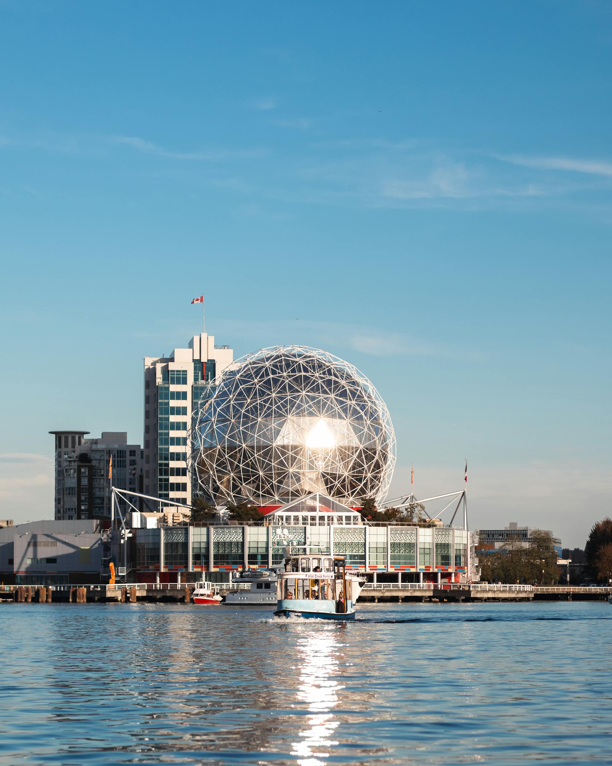 Stunning view of the Science World building reflecting on the water in Vancouver, Canada.